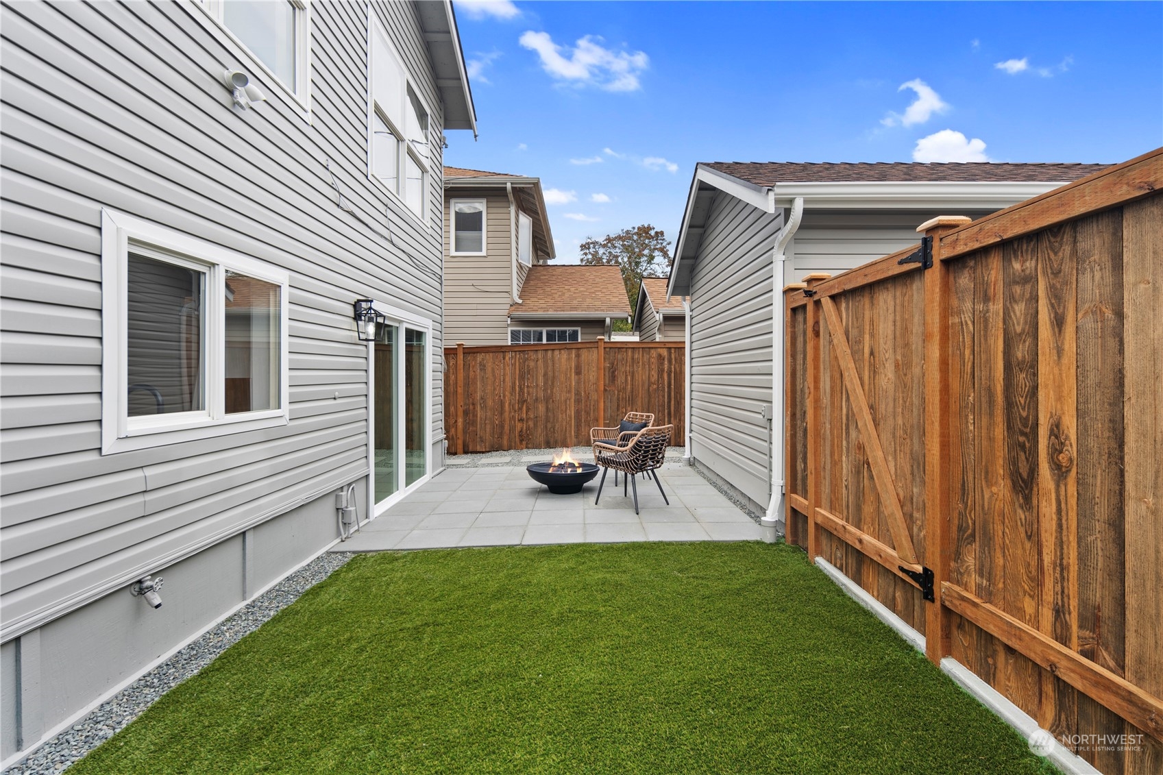 1722 26th Avenue South Seattle, WA 98144 - Photo 23 of 26 a view of a backyard with sitting area and tub
