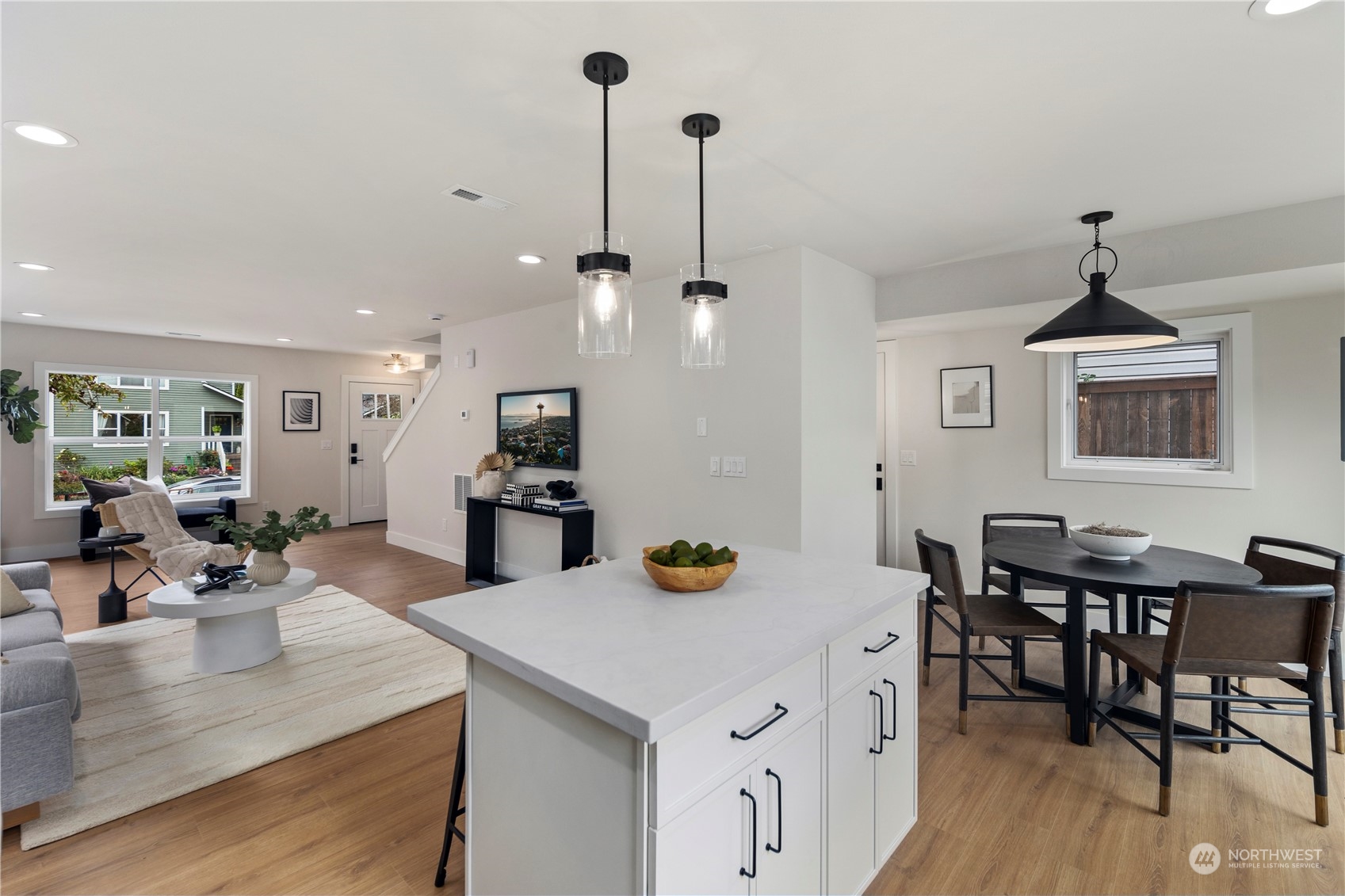 1722 26th Avenue South Seattle, WA 98144 - Photo 9 of 26 a view of a dining room and livingroom with furniture wooden floor a chandelier