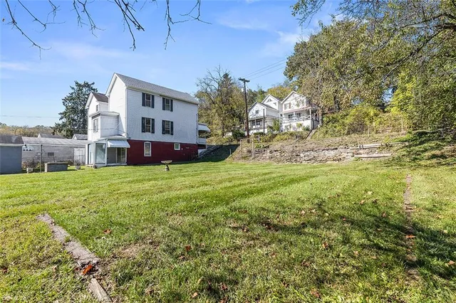 a view of a park with large trees