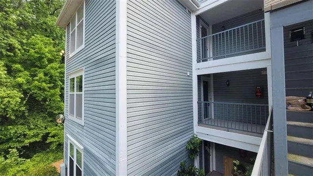 a view of a house with a door and balcony