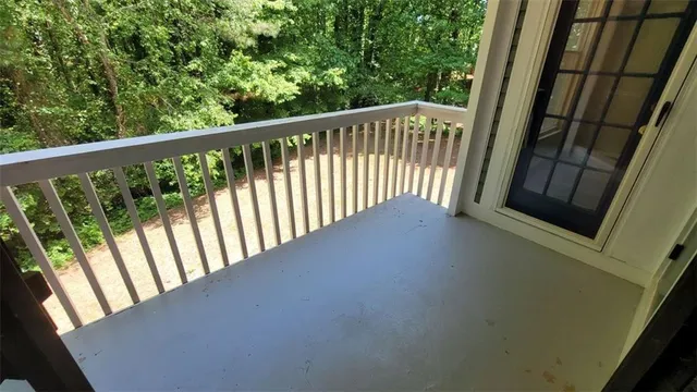 a view of balcony with wooden floor