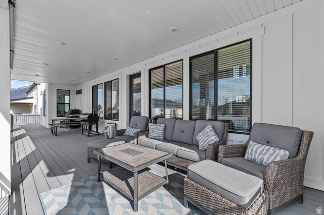 1426 South 1450th Street West Mapleton, UT 84664 - Photo 40 of 50 Spacious covered patio featuring a white beadboard ceiling, a durable composite deck, and dark-framed windows