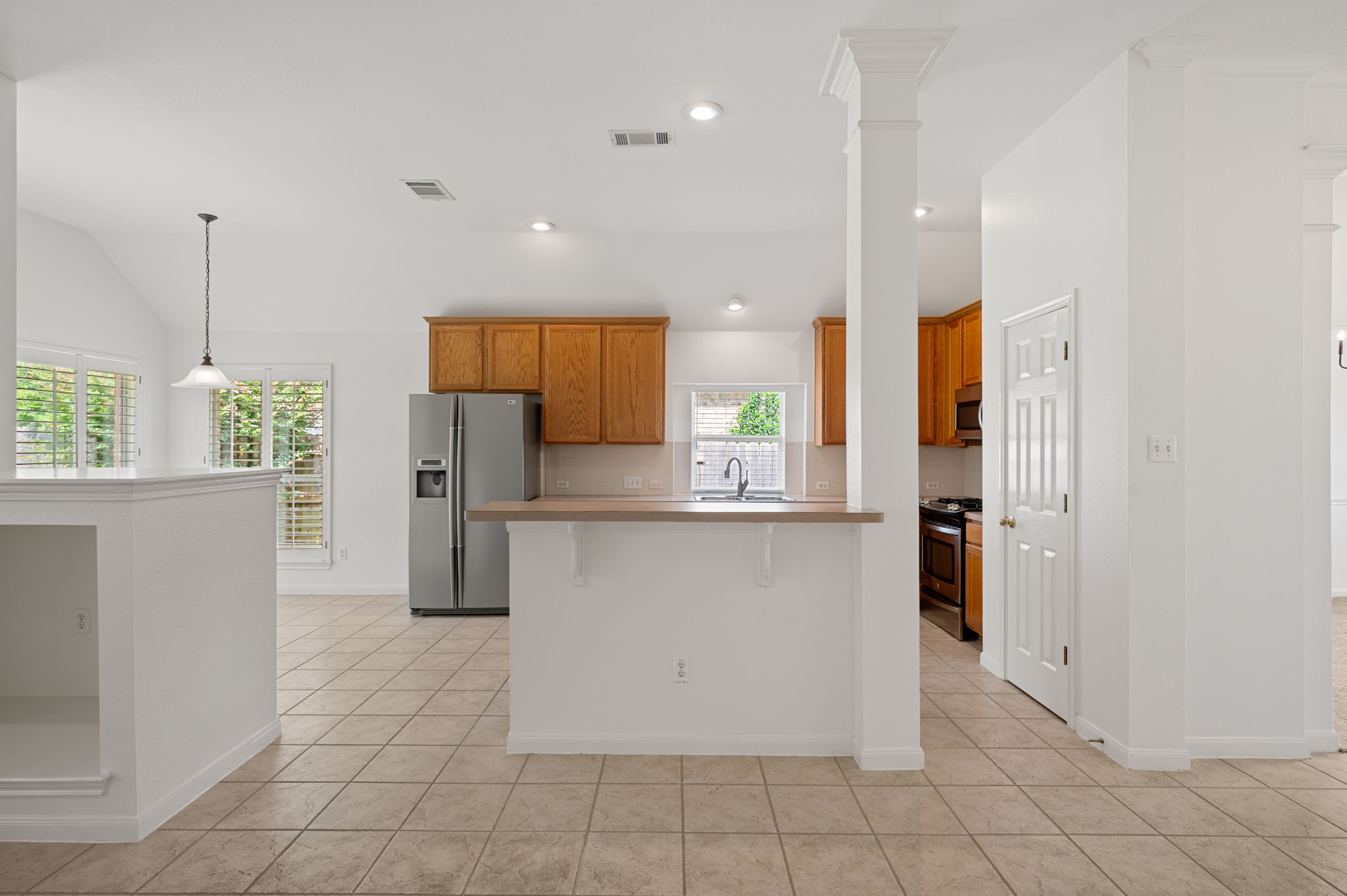 9201 La Siesta Bend Austin, TX 78749 - Photo 9 of 37 a kitchen with stainless steel appliances a refrigerator sink and microwave