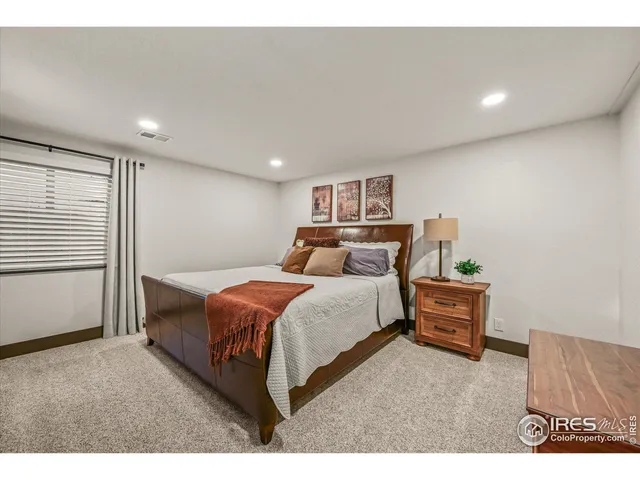 a patio with glass top table and chairs