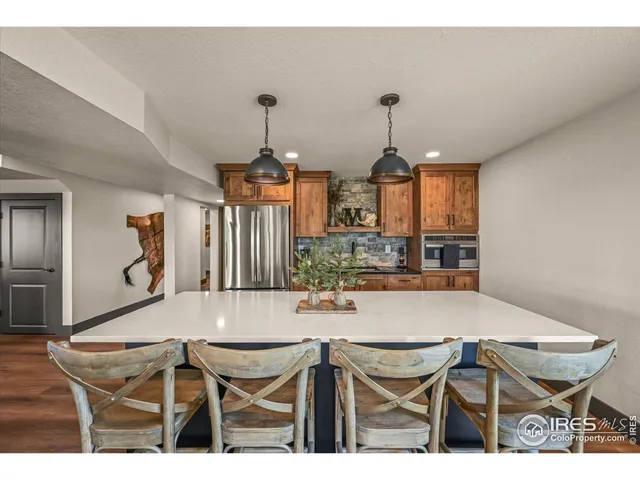 a view of a field with mountains in the background