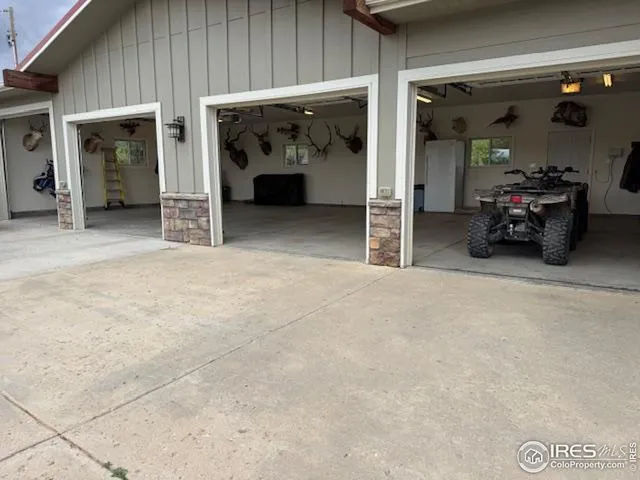 an aerial view of a houses with a yard