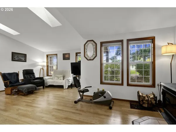 a living room with furniture window and a flat screen tv