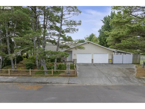 a view of an house with backyard space and garden