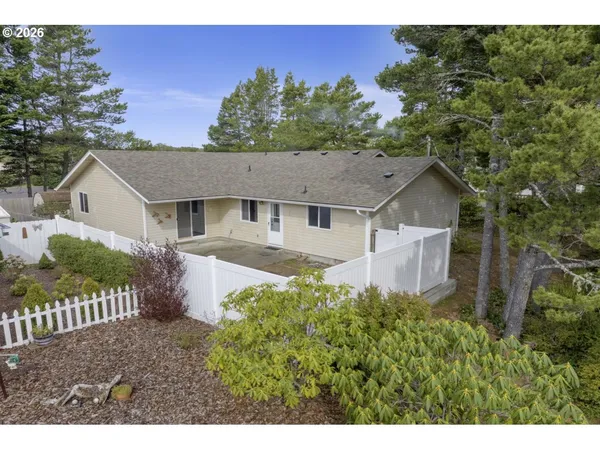a aerial view of a house with a yard