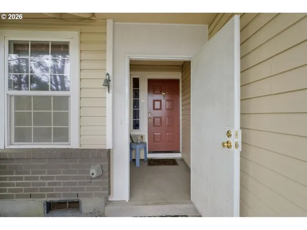 a view of outdoor space and front door of house
