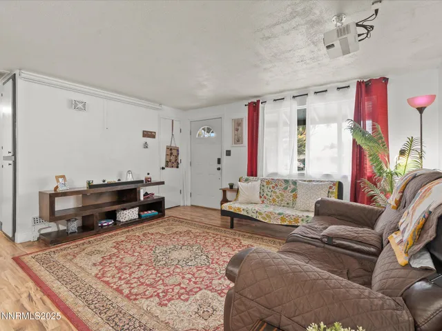 a living room with furniture and a rug