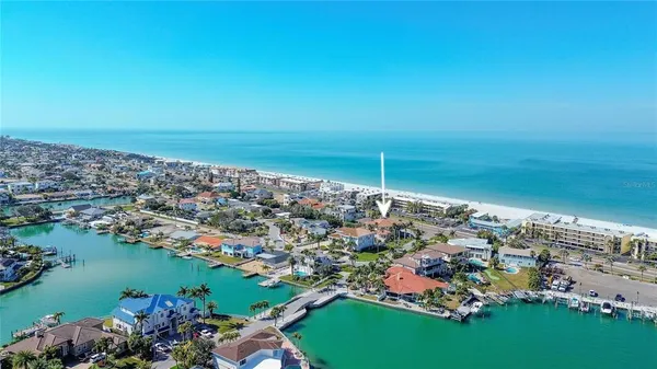 an aerial view of a city with ocean view
