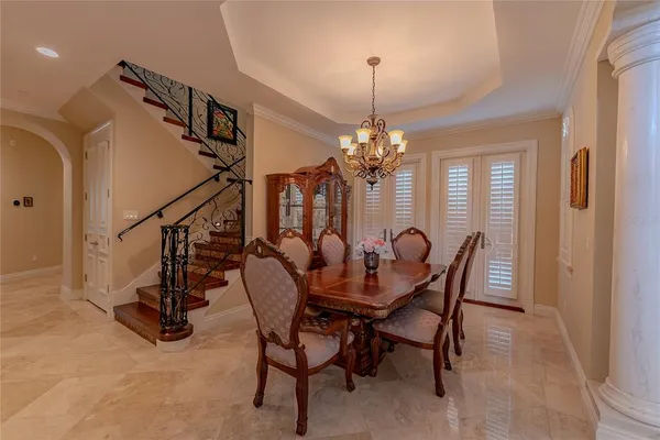 a dining room with furniture and window