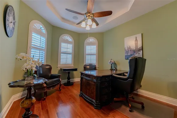 a bedroom with a bed dresser and a window