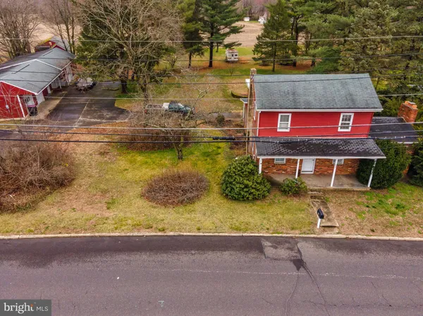 a view of bathroom with a sink a toilet and shower curtain