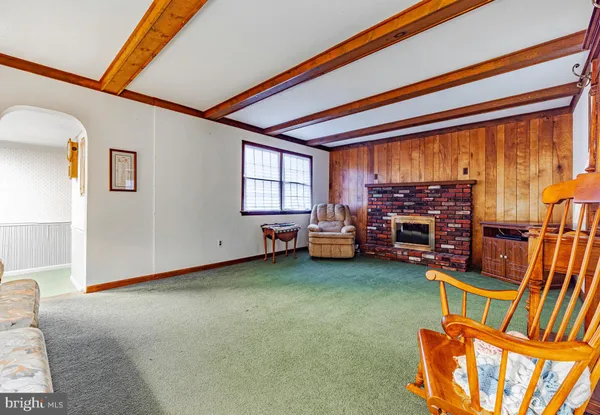 a view of a dining room with furniture and a window