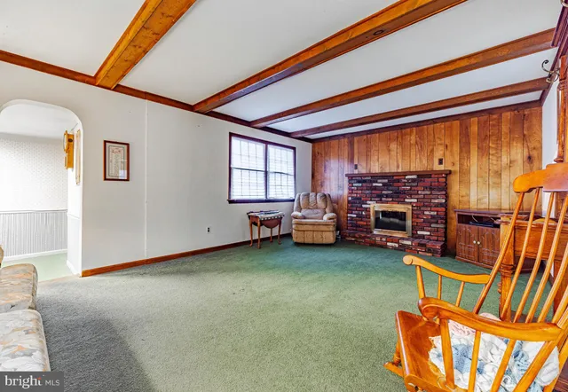 a view of a dining room with furniture and a window