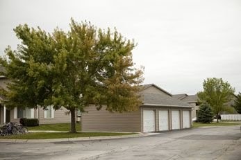 2065 Nash Boulevard Other, IA 51501 - Photo 3 of 8 a front view of a house with a garden