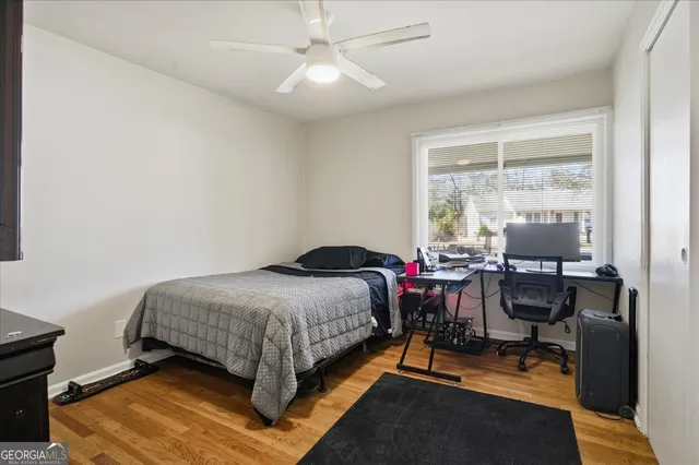 a bedroom with bed and a window