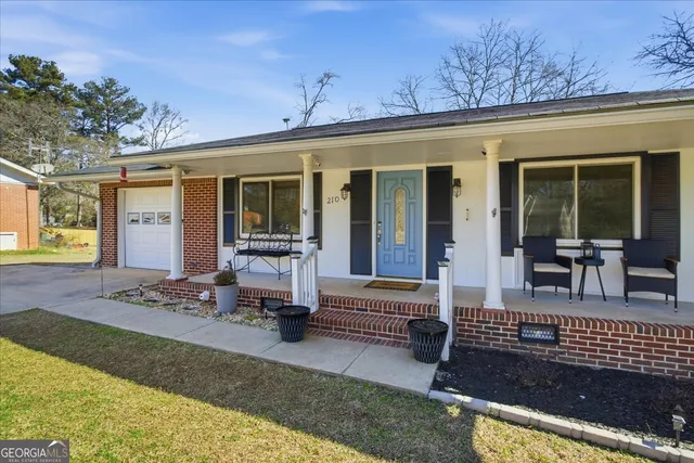front view of house with outdoor seating