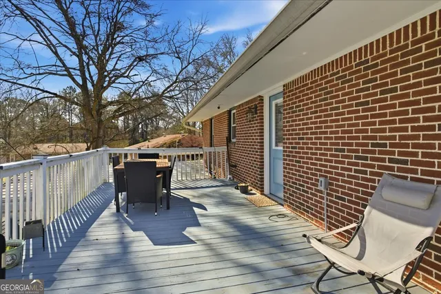 a view of a patio with wooden floor