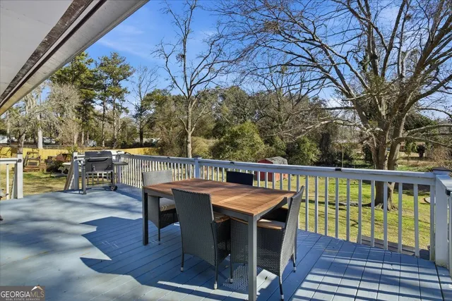 a view of a balcony with chairs