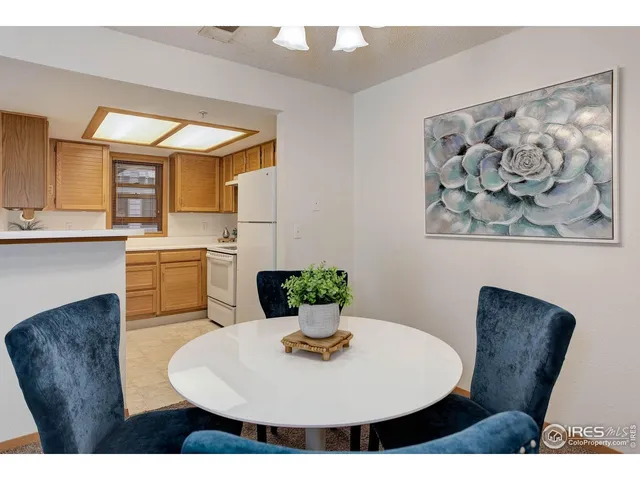 a dining room with a table and chairs