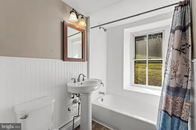 a bedroom with a bed and a table in it