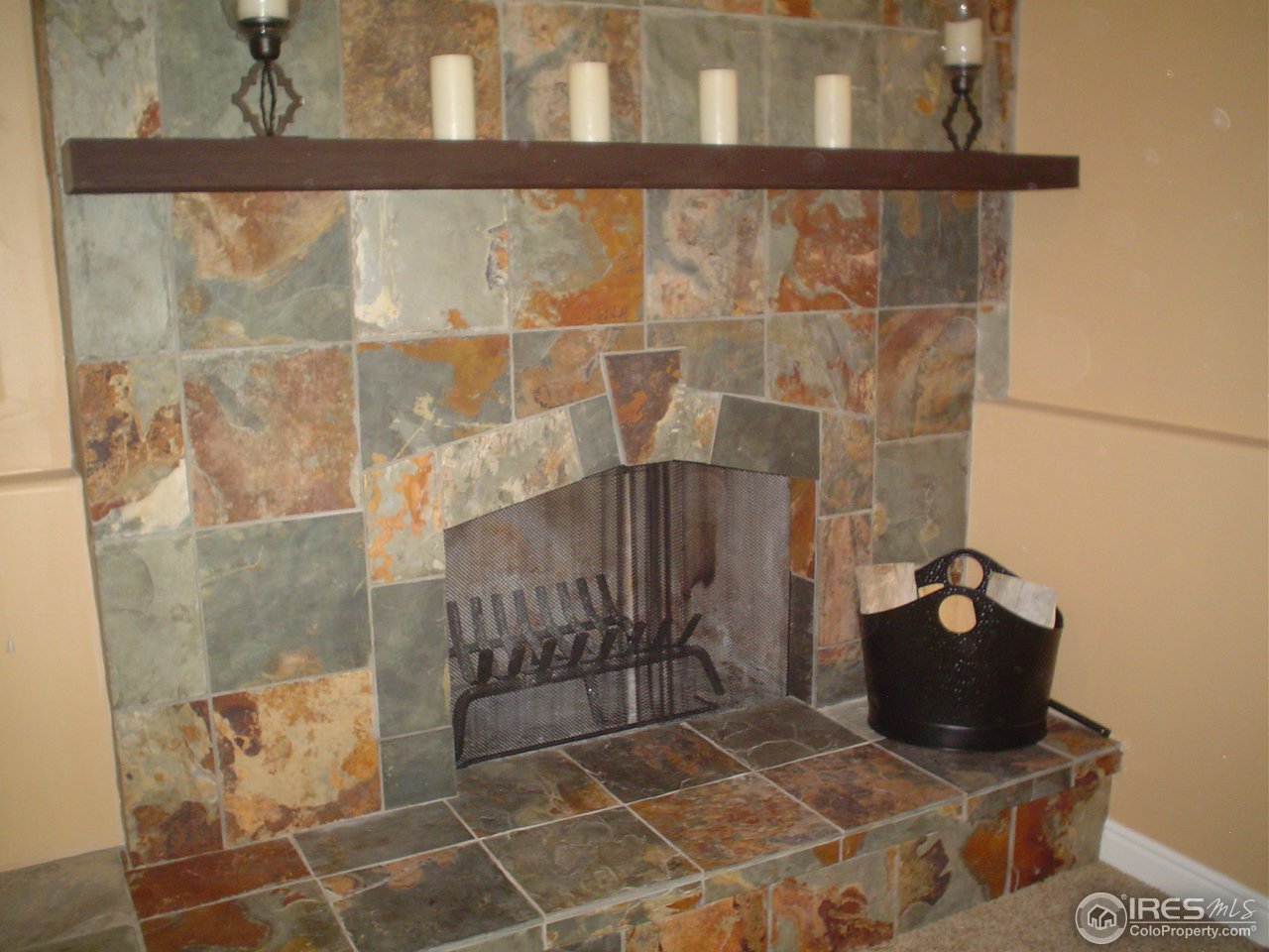 9231 Apache Road Longmont, CO 80504 - Photo 13 of 25 Fireplace with slate tile