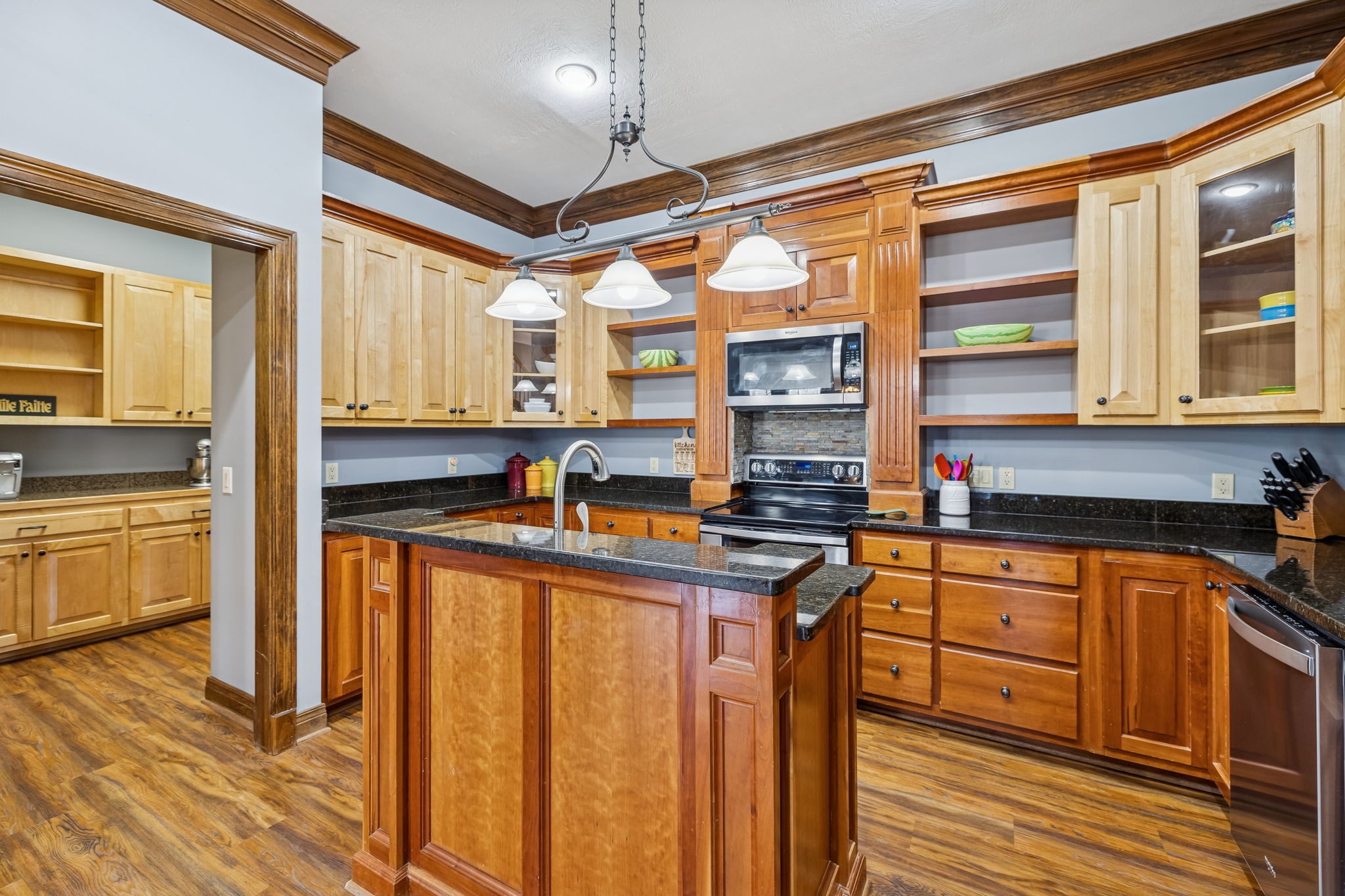 480 Defeated Creek Road Centerville, TN 37033 - Photo 14 of 97 a kitchen with stainless steel appliances granite countertop a stove a sink and a refrigerator