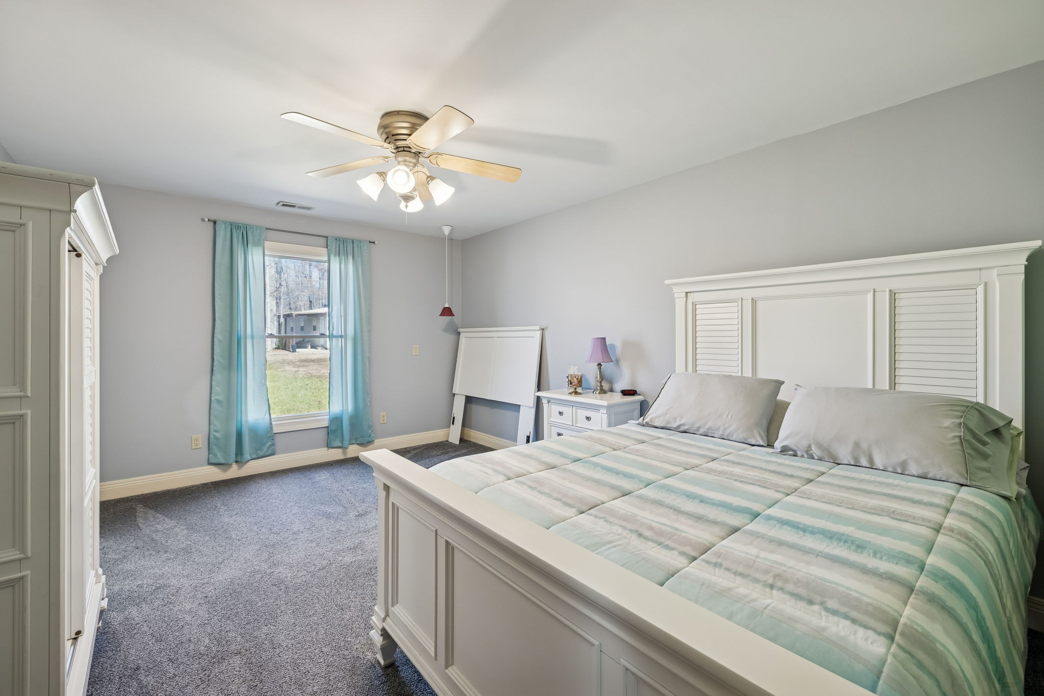 480 Defeated Creek Road Centerville, TN 37033 - Photo 37 of 97 a bedroom with a bed and a chandelier