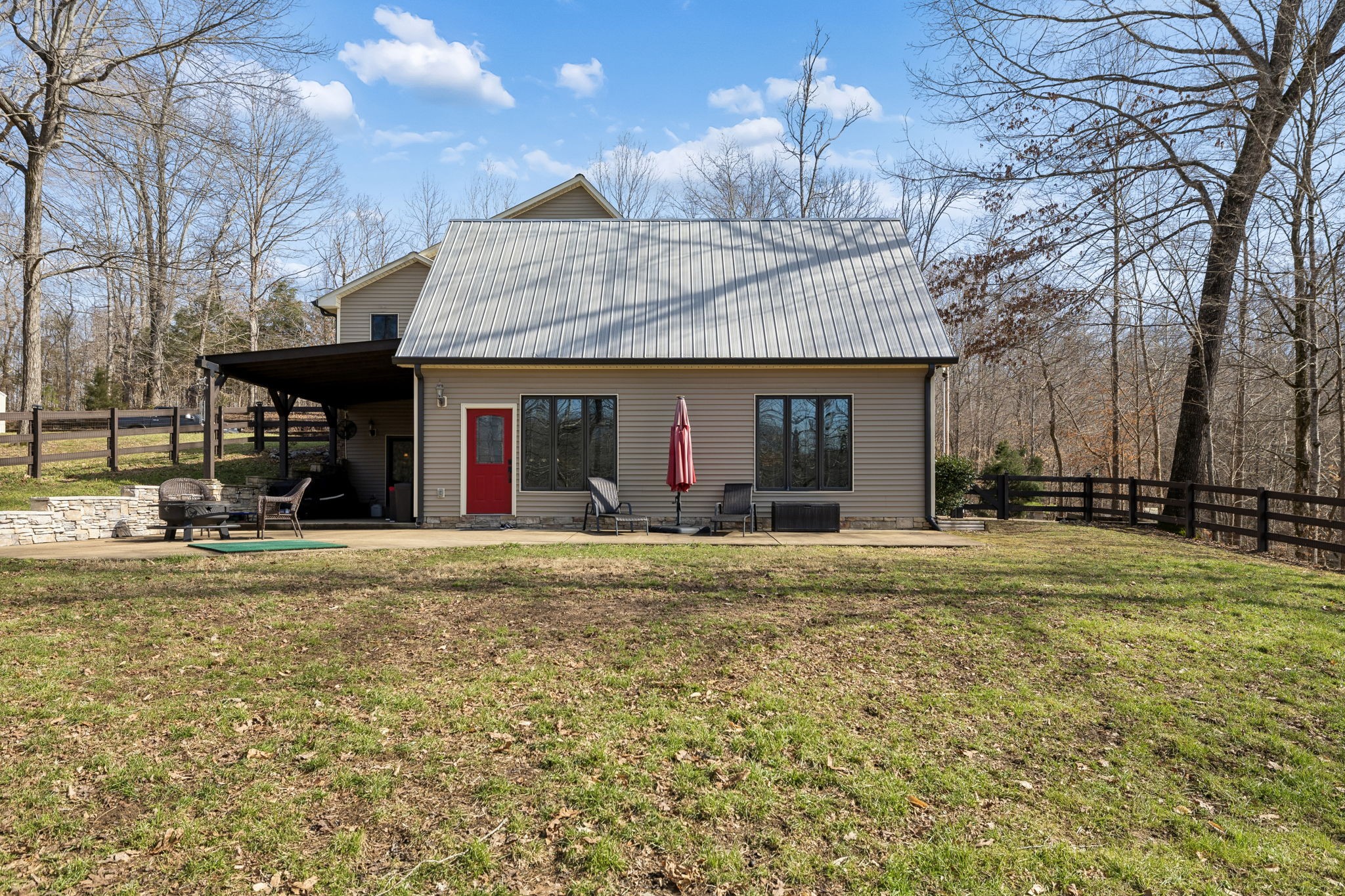 480 Defeated Creek Road Centerville, TN 37033 - Photo 54 of 97 a view of a house with a patio and a yard