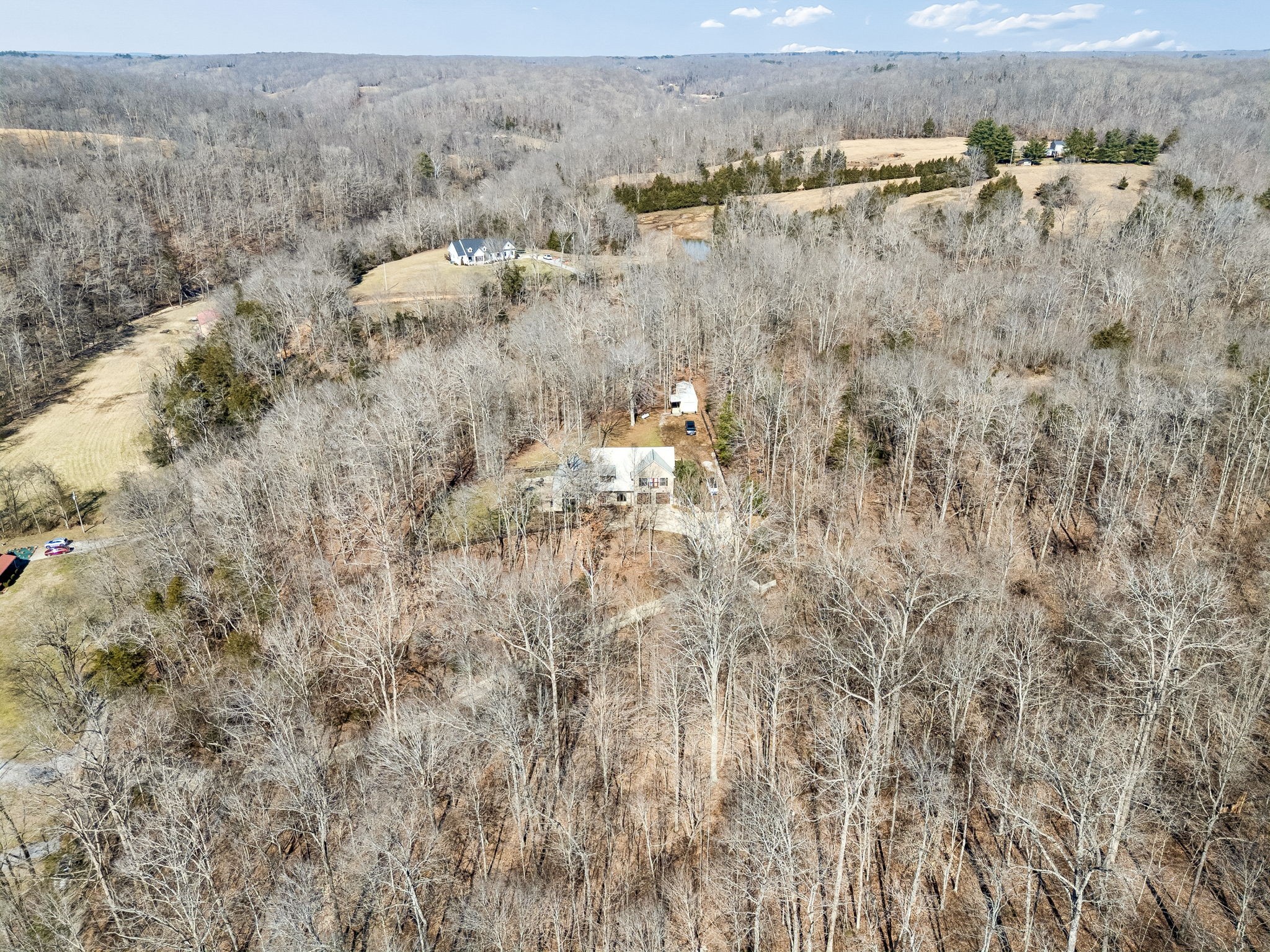 480 Defeated Creek Road Centerville, TN 37033 - Photo 63 of 97 an aerial view of residential houses with outdoor space and trees