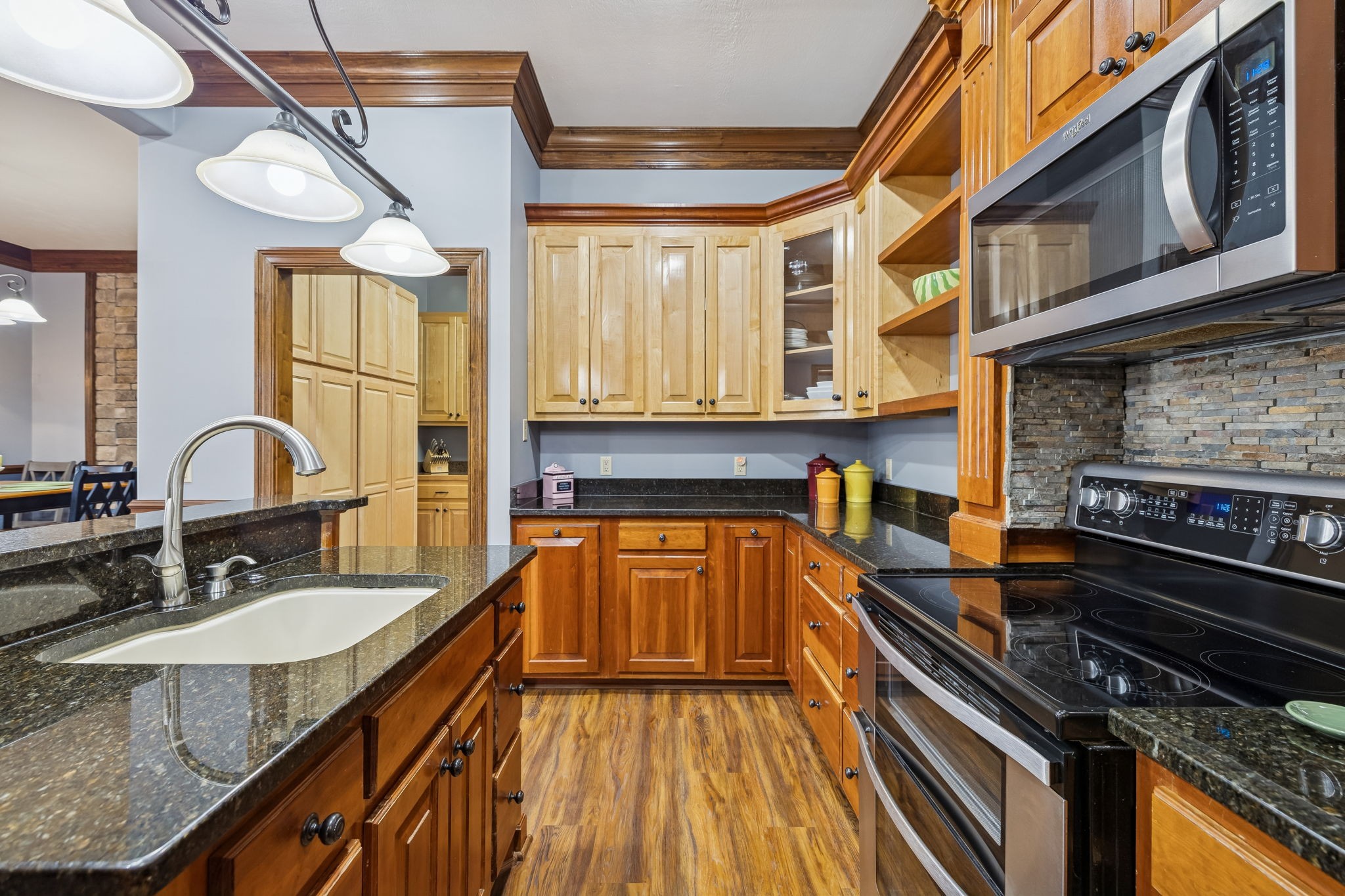 480 Defeated Creek Road Centerville, TN 37033 - Photo 86 of 97 a kitchen with stainless steel appliances granite countertop a stove and a sink