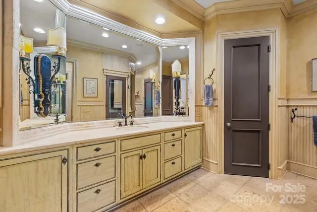 a spacious bathroom with a shower sink and mirror