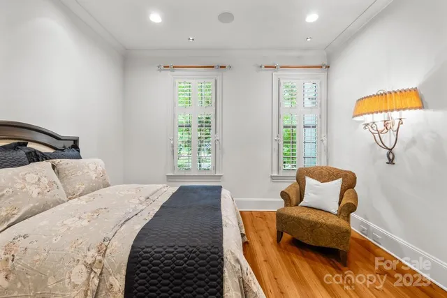 a bedroom with furniture and a window