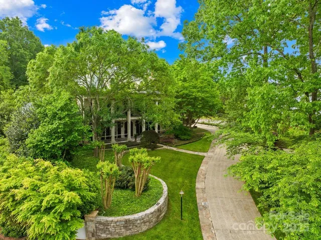 a garden view with a fountain