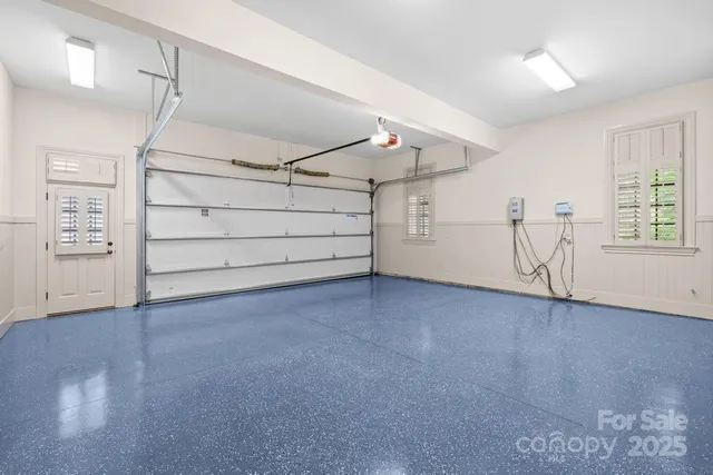 a view of a house with a yard and garage