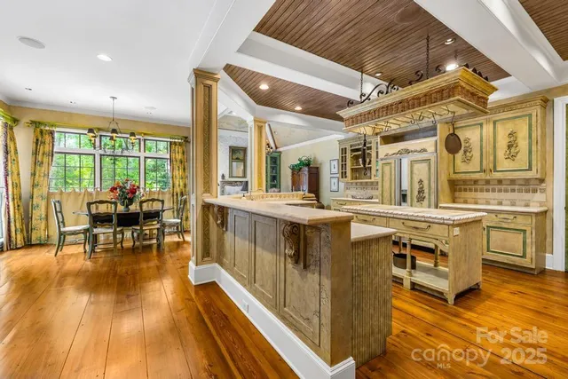 a open kitchen with stainless steel appliances granite countertop a stove and cabinets