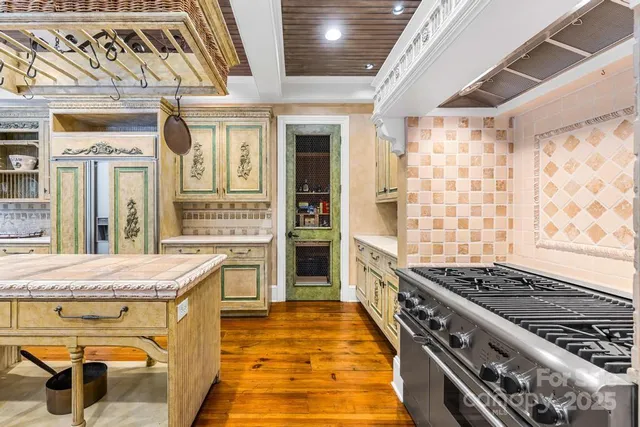 a kitchen with a stove and a sink