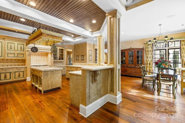 a view of kitchen with furniture and wooden floor