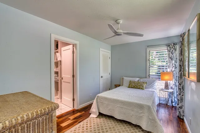 a living room with furniture and large windows