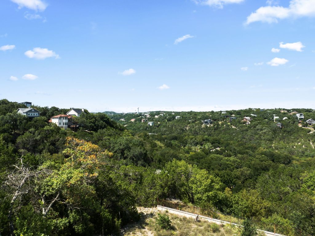 2314 Little Beaver Trail Austin, TX 78734 - Photo 4 of 39 a view of a green field with lots of bushes