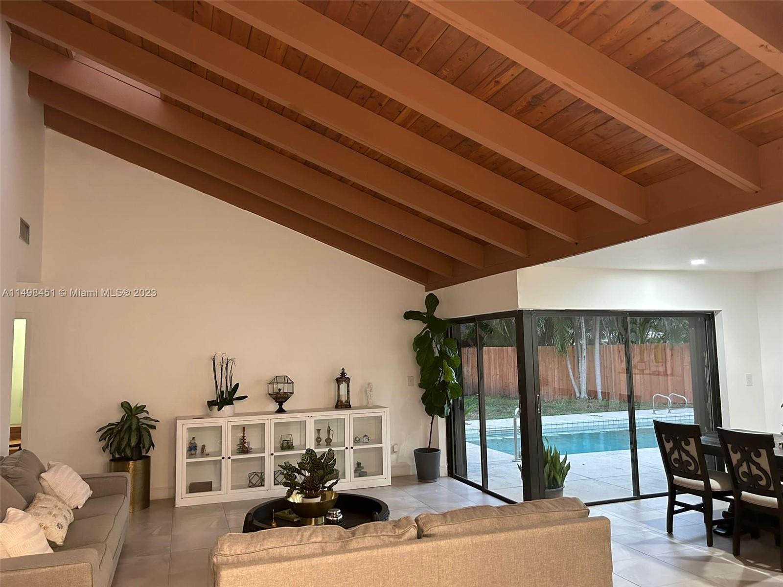 92 Juniper Road, Unit 92 Hollywood, FL 33021 - Photo 1 of 32 a view of a livingroom with furniture and window