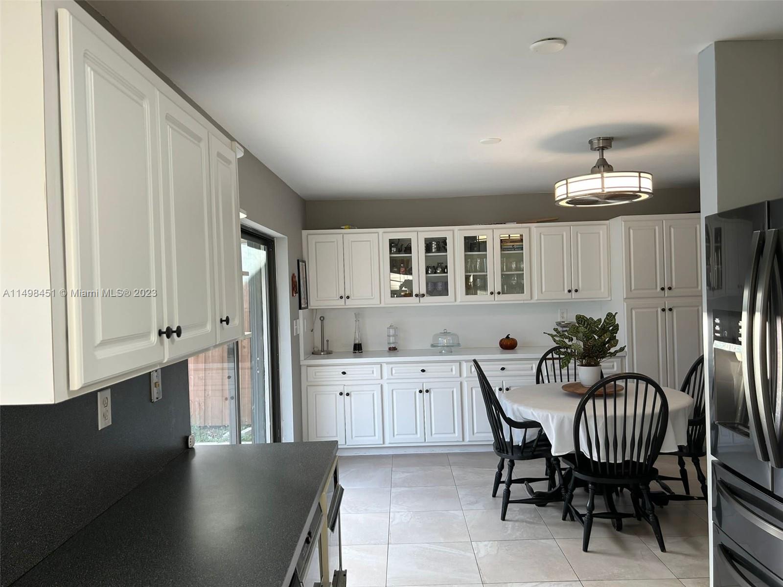 92 Juniper Road, Unit 92 Hollywood, FL 33021 - Photo 23 of 32 a view of a livingroom with furniture and window