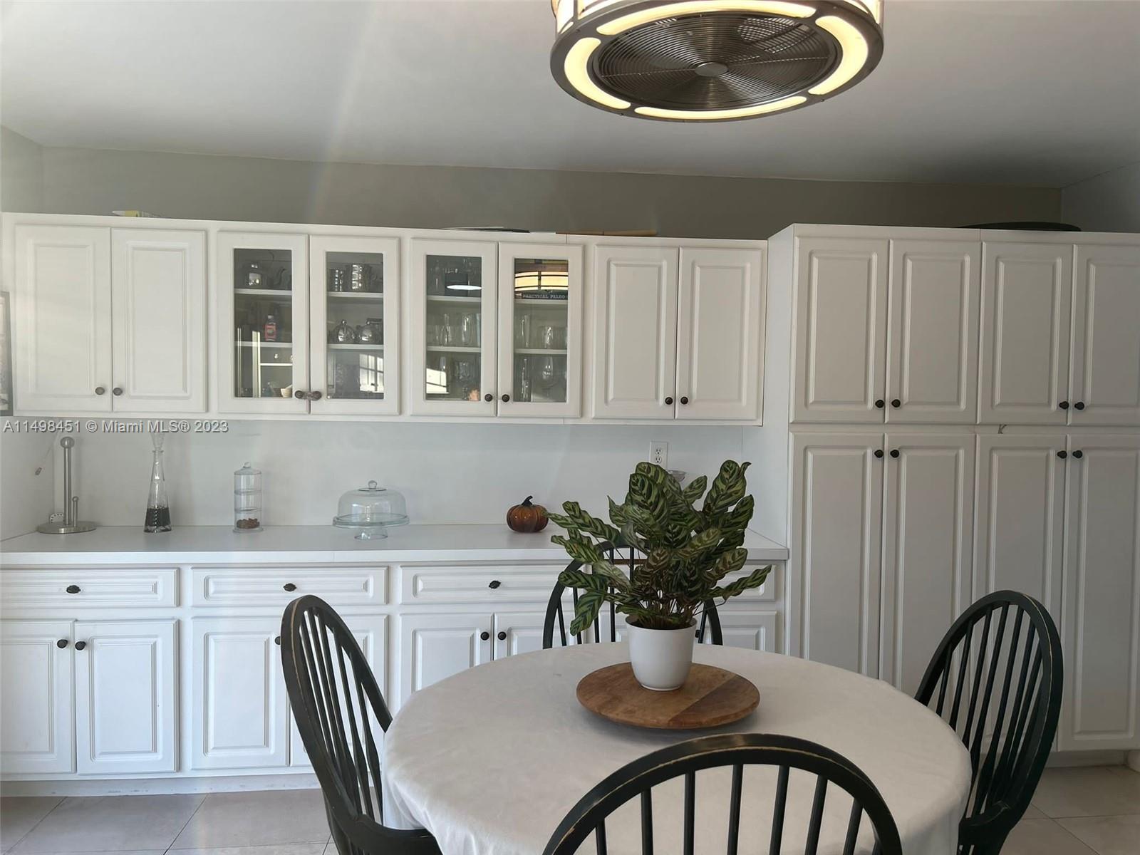 92 Juniper Road, Unit 92 Hollywood, FL 33021 - Photo 24 of 32 a dining room with furniture and window
