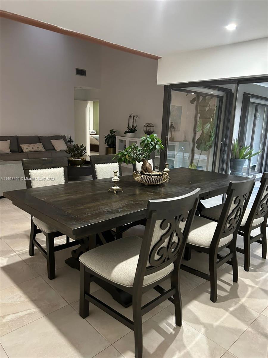 92 Juniper Road, Unit 92 Hollywood, FL 33021 - Photo 28 of 32 a view of a dining room with furniture