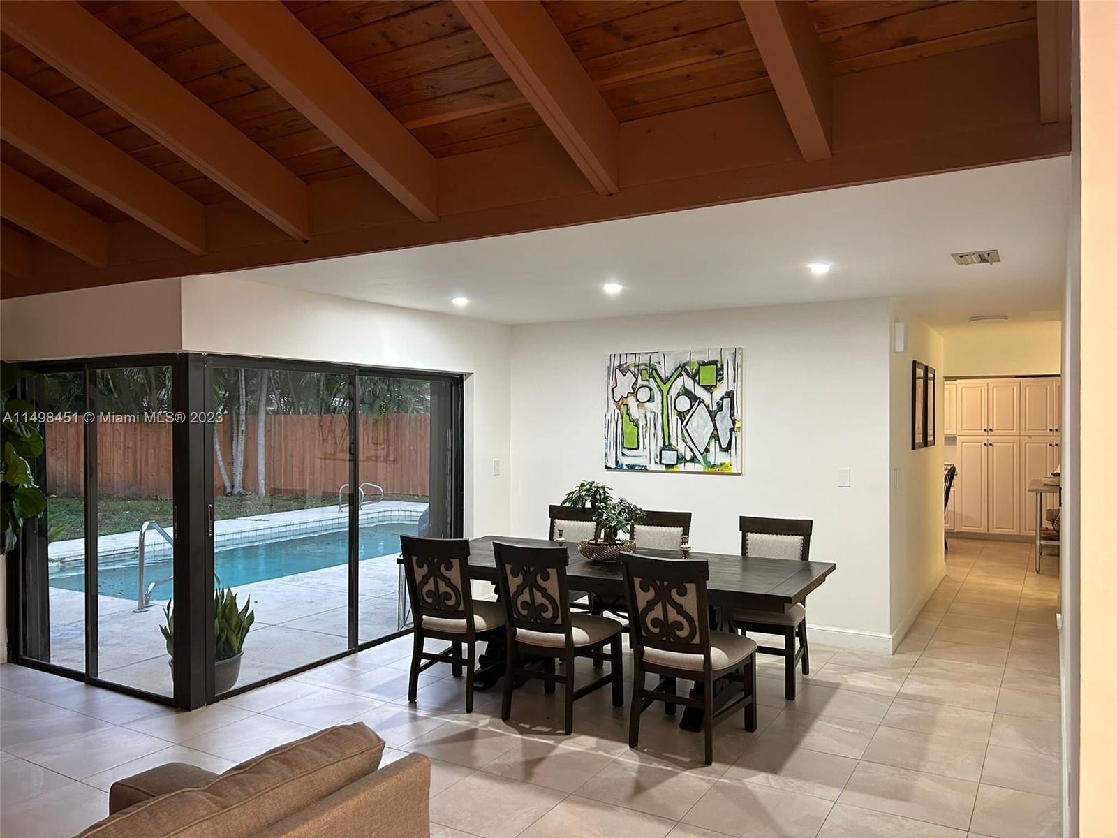 92 Juniper Road, Unit 92 Hollywood, FL 33021 - Photo 30 of 32 a view of a dining room with furniture window and outside view
