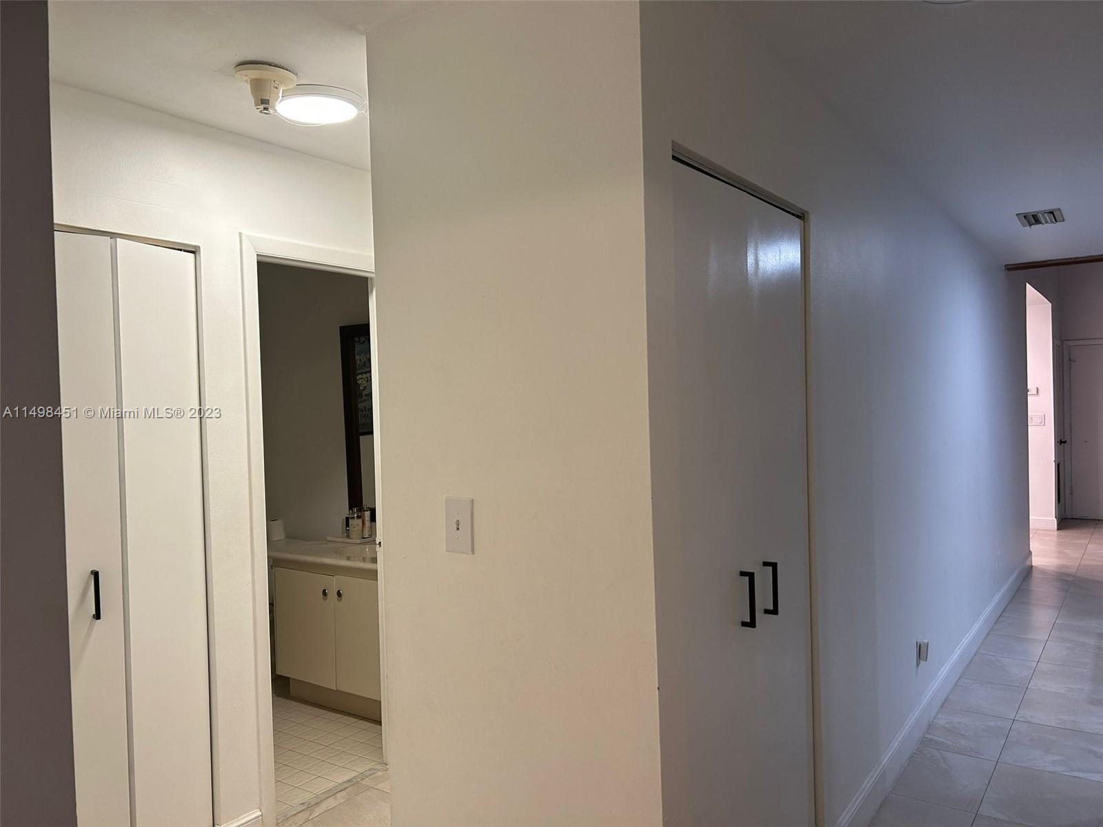92 Juniper Road, Unit 92 Hollywood, FL 33021 - Photo 31 of 32 a view of hallway with sink and closet