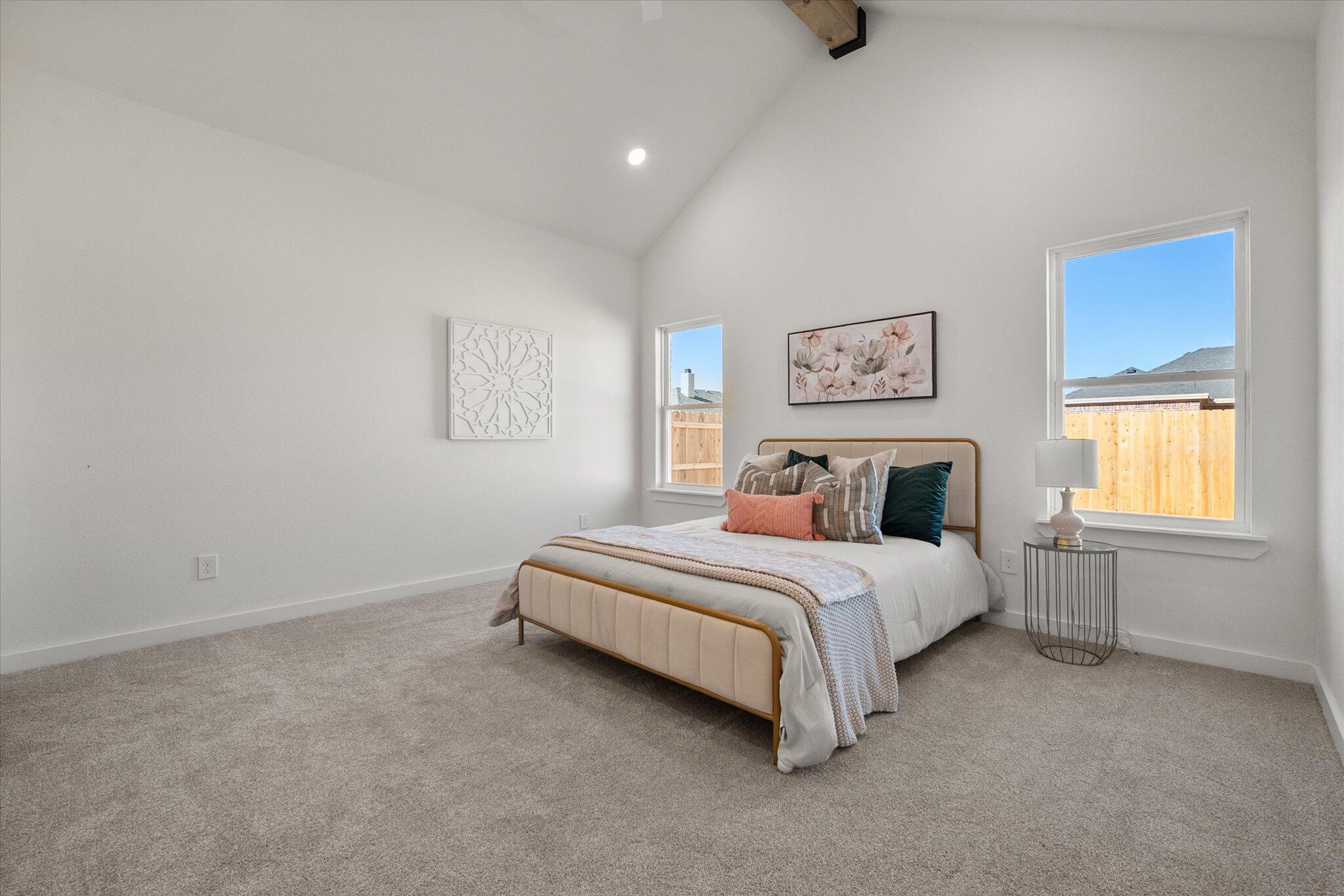 6928 14th Street Lubbock, TX 79416 - Photo 18 of 33 a spacious bedroom with a bed and window